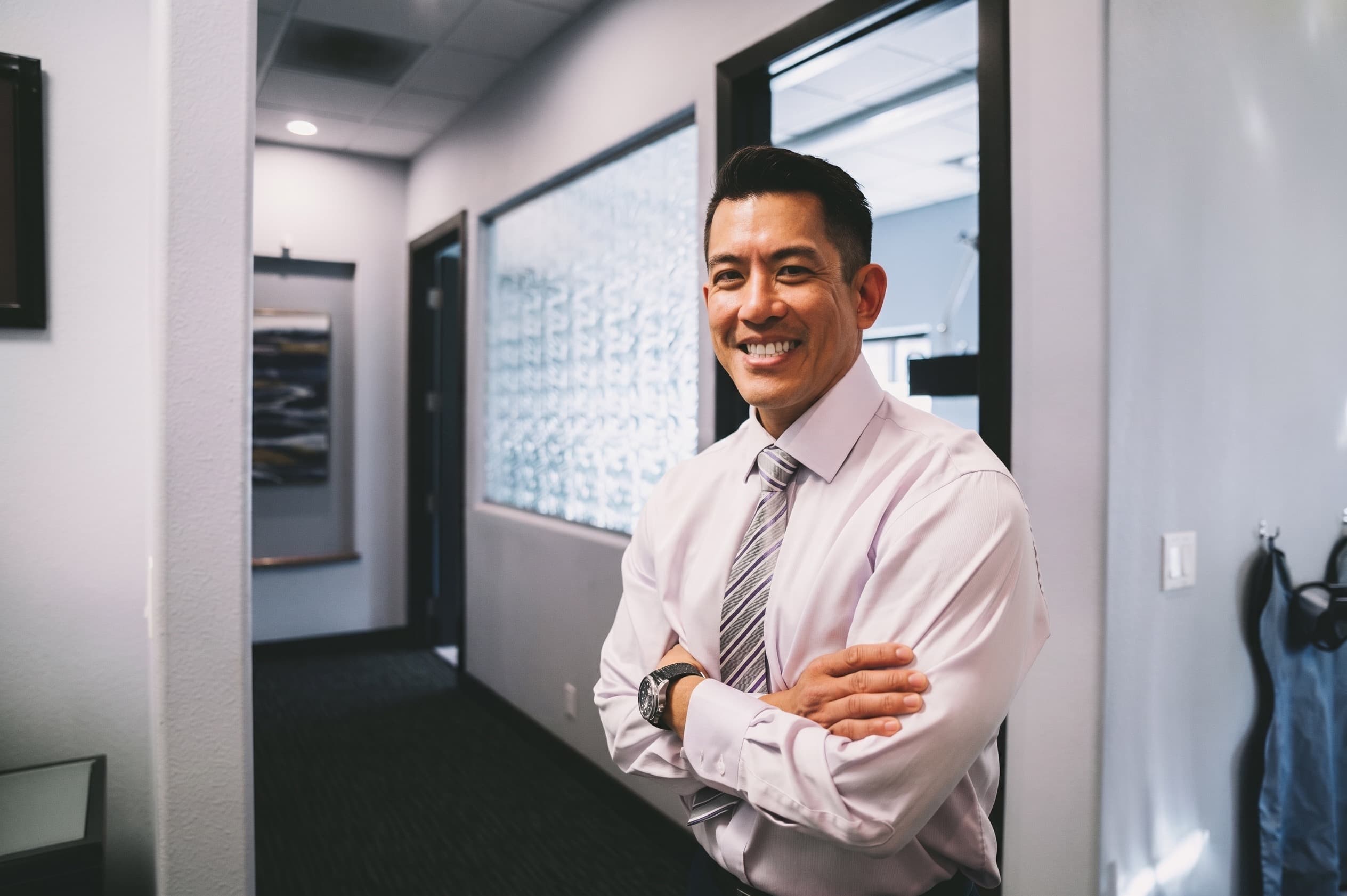 Dr. Goh in the practice hallway · candid