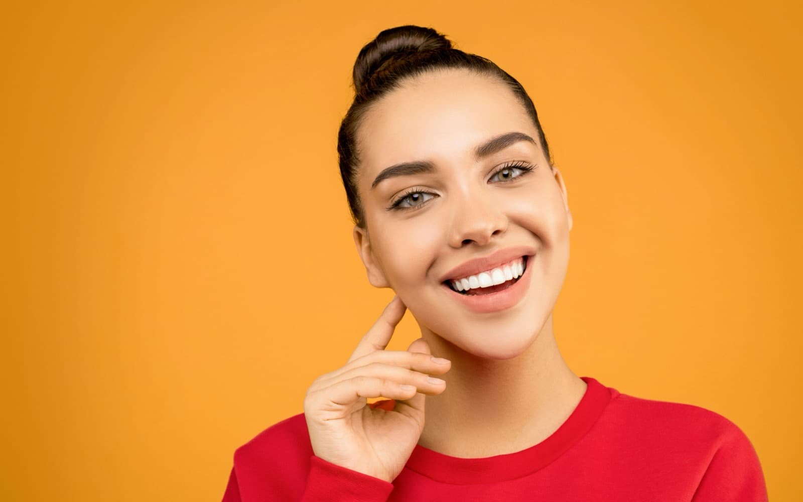 Invisalign® — clear aligner in hand, real and consented